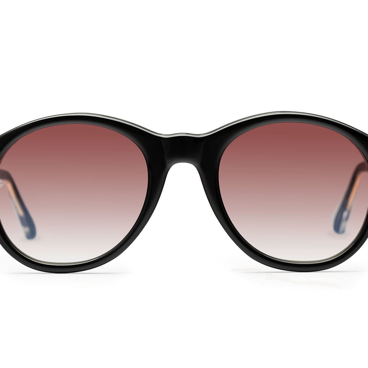 Eros round sunglasses in Black with rose lenses — Italian-made luxury eyewear by J. Goldin, designed in Atlanta.
