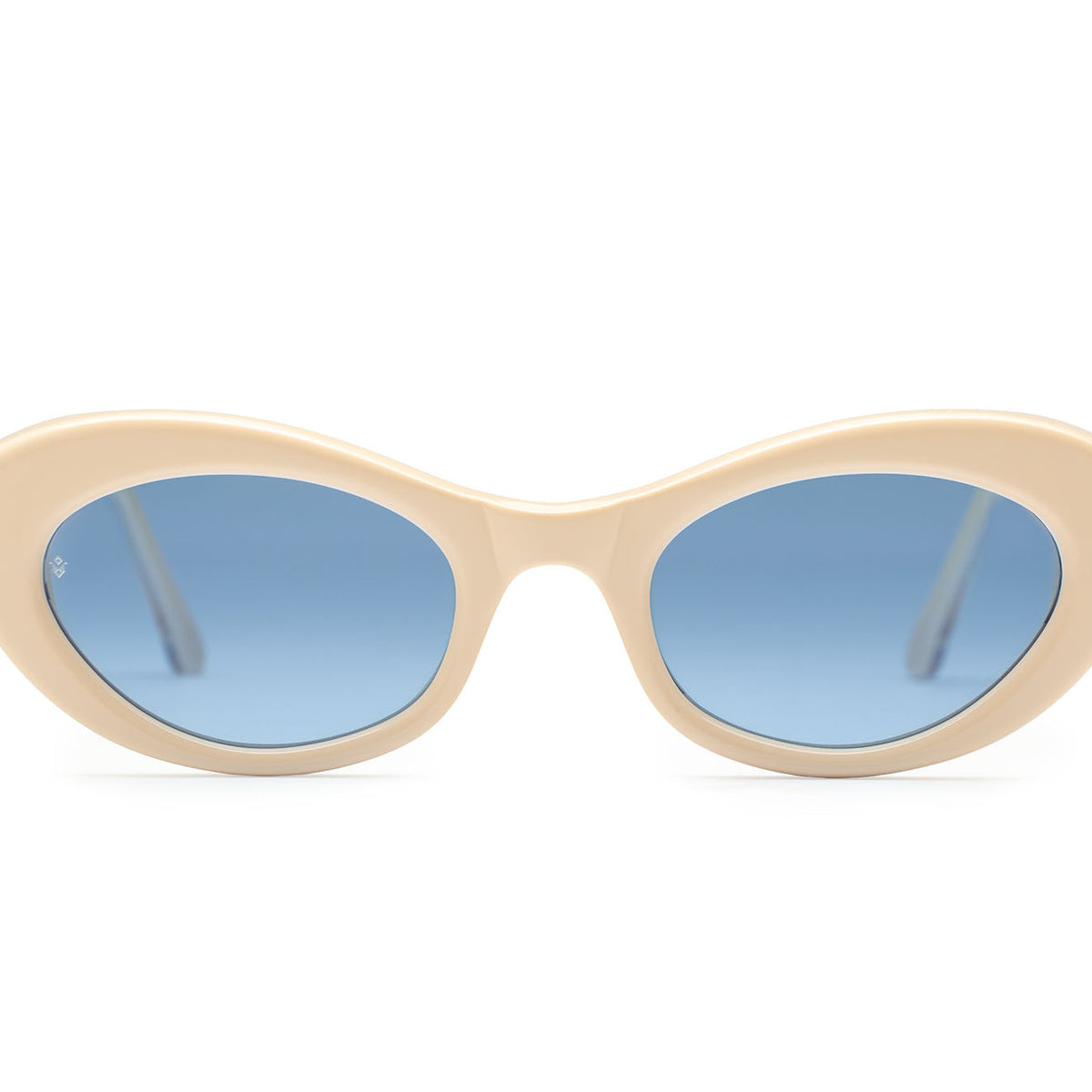 Vesta cat-eye sunglasses in Milk White with cobalt blue lenses — luxury Italian-made eyewear by J. Goldin, Atlanta.